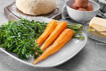 Ingredients for baking carrot cake on table