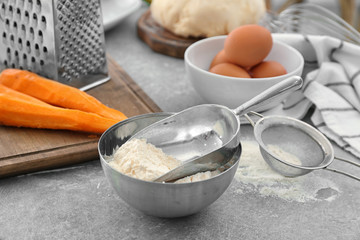 Fototapeta na wymiar Ingredients for baking carrot cake on table
