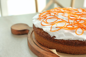 Delicious carrot cake on wooden board