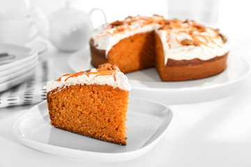 Delicious carrot cake on table