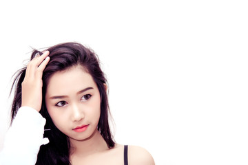 Fototapeta premium Beauty portrait of women with straight hair and natural skin. Selective focus. White background with copy space. Spa girl.