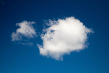 Fototapeta premium Big and small white clouds at bright blue sky