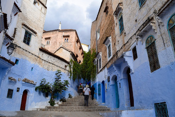 Fototapeta na wymiar Stairs leading into the blue-painted streets of the Chefchaouen Medina, Morocco