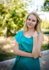 Young pretty blonde walking in a park