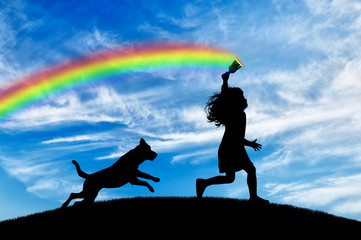 Child draws a rainbow in sky