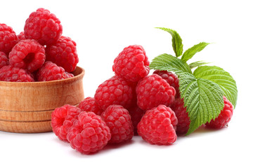 ripe raspberries with green leaf isolated on white background macro