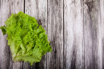 Lettuce leaves on a wooden background