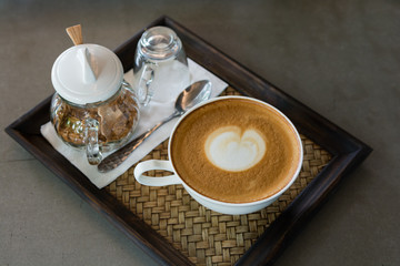 cappuccino cup of coffee on wooden table