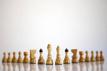 White chess pieces on a white background