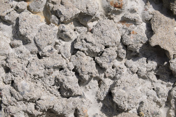 frozen pieces of cement on the rocks