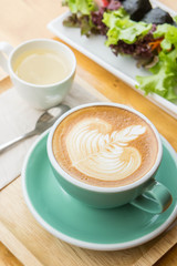 coffee cup on wood table in coffee shop