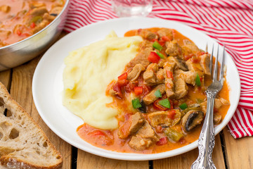 Hungarian meat stew Porkolt with veal and sweet pepper