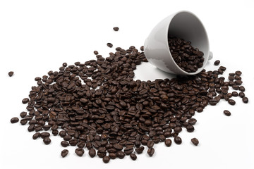 Roasted coffee beans in a cup of coffee
