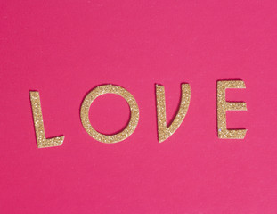 Shiny golden letters forming the word love