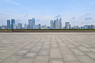 Empty floor with modern skyline and buildings