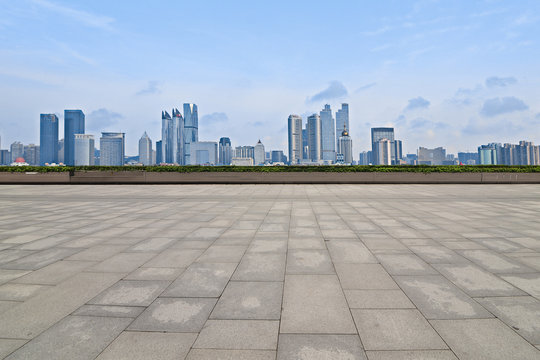 Empty floor with modern skyline and buildings © onlyyouqj