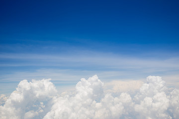 Photograph of a group of cloud and beautiful clear blue sky in above angle view background.