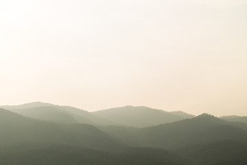 Obraz premium Landscape of forest and mountain during the sun set.