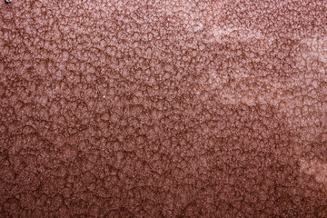 brown or bronze hammered metal background,abstract metalic texture, sheet of metal surface painted with hammer paint