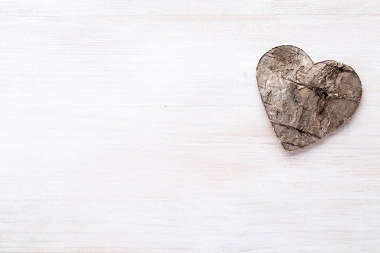 Background with wooden hearts, place for text.