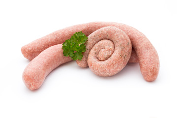 Raw sausages with herbs and spices.