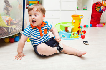 funny baby taking off his socks