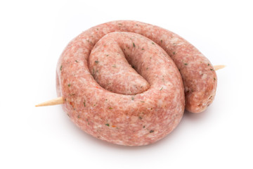 Raw sausages with herbs and spices.