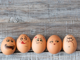 Eggs with painted faces. Photo for your design. Concept of joint recreation