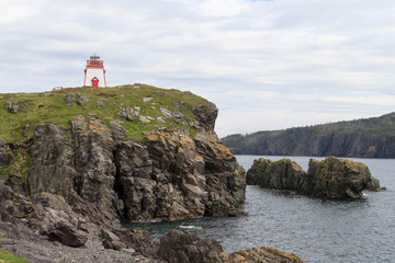 Fototapeta na wymiar Light tower on coastline, Newfoundland and Labrador, Canada.