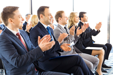Business audience applaud at training
