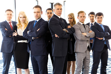 Business people with arms crossed