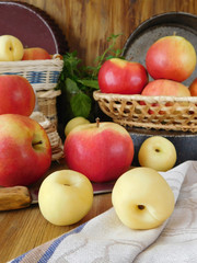 Naklejka na ściany i meble Apples and white nectarines on a wooden table. Fresh harvest
