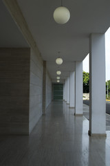 Corridor with columns and lamps