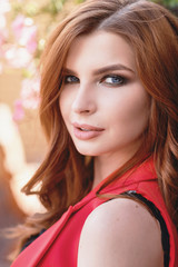 Portrait of a young beautiful girl, close-up. Model posing on a warm sunny day