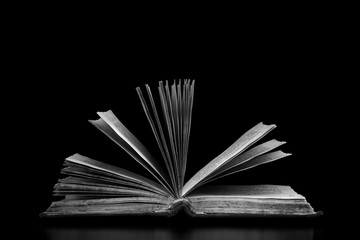 Open book on a black background