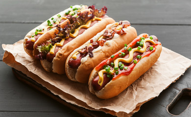 Barbecue Grilled Hot Dogs with  yellow American mustard, On a dark wooden background - 166117369