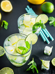Refreshing summer cocktail with crushed ice and lame with lemon