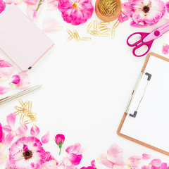 Flat lay fashion feminine home office workspace with clipboard, notebook, pen, pink flowers and accessories on white background. Top view.