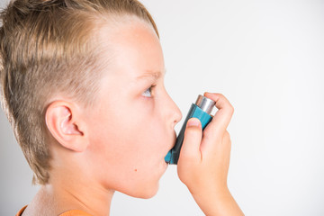 A child with an inhaler, an asthma attack, a treatment, an allergy