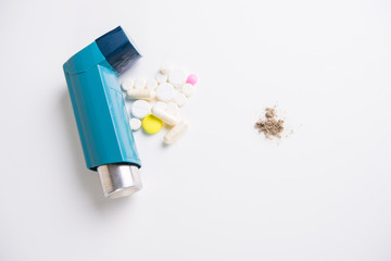 Inhaler for relief of attacks of allergy and asthma, tablets and various medications and household dust as an allergen close-up