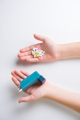 .Inhaler for relief of allergy and asthma attacks in the hand close up