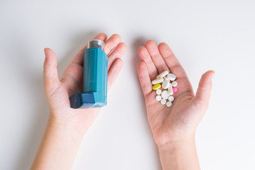 .Inhaler for relief of allergy and asthma attacks in the hand close up