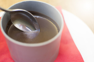 Chocolate pudding. Bowl of chocolate cream.