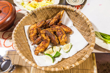 Japanese style fried chicken wing with lime slice