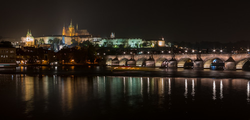 Fototapeta premium Panoramic night shot of the Prague Castle, Vltava River and the Old Town District (Mala Strana), Czech Republic, Czechia