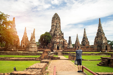 Obraz premium Tourism man take a photo of ancient Buddha with digital camera .