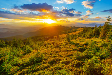 Fototapeta na wymiar dramatic sunset scene over a mountain valley