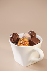 many chocolates in mug