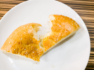 Bread on a white plate in a cafe