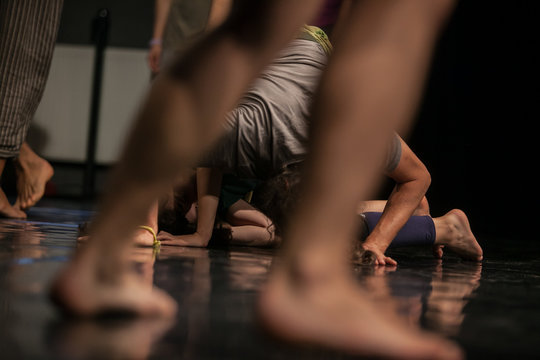 dancers foots, legs,dacers legs, barefoots in motion  near floor on blurred background